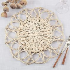 Fennco Styles Hand Twisted Rattan Floral Placemat 15" Round, 1- Piece Add instant boho elegance to your home with this Floral Rattan Placemat. Featuring a flower-inspired design, a subtle natural color finish, and an intricately woven pattern inject texture and warmth to any style. Chic and organic, this rattan placemat infuses an airy, rustic ambiance creating a transformative table design that echoes the beauty of nature. It's a great alternative to a charger plate and perfect for your dinner, Rattan Placemat, Rattan Placemats, Home Boho, Flower Table, Charger Plate, Stylish Tables, Small Potted Plants, Woven Pattern, Inspired Living