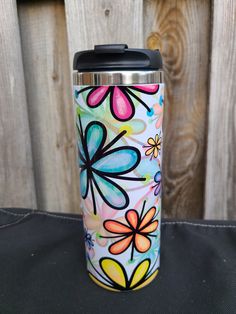 the colorful flower design on this travel mug is perfect for cold weather and it's easy to clean