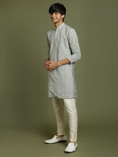 YUVA BY VASTRAMAY Boys' Grey Georgette Chikankari Kurta Pyjama Set This elegant kurta pyjama set features a grey georgette kurta with beautiful chikankari embroidery. The kurta has a mandarin collar, long sleeves, and a button placket. The set comes with matching solid viscose pyjamas for a comfortable and stylish look. Perfect for special occasions or everyday wear. Key Features Grey georgette kurta with chikankari embroidery Mandarin collar Long sleeves Button placket Straight hem with side sl Georgette Chikankari Kurta, Georgette Kurta, Chikankari Embroidery, Chikankari Kurta, Kurta Pyjama, Mens Attire, Boys Wear, Kurta Set, Pyjama Set