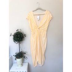 Summery & Flirty! Size Medium. Low Cut. Front Slit. Knot At Front. New With Tag. 100% Raylon Dresses Yellow, Knot Dress, Yellow Dress, Low Cut, Yellow White, High Low Dress, High & Low, High Low, White Stripe