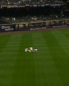 a baseball player sliding into home plate during a game