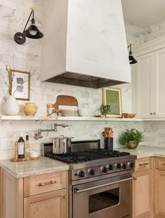 a stove top oven sitting inside of a kitchen next to wooden cabinets and counter tops