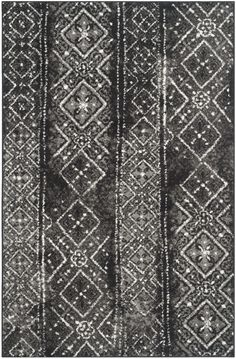 a black and white rug with an abstract design