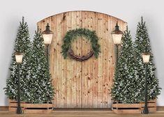 a wooden wall with christmas wreaths and lights on it next to two benches in front of trees