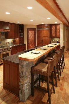 a large kitchen with an island in the middle