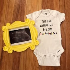 a baby's bodysuit with the words, the one where we become parents