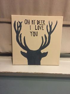 a sign with the words oh my deer i love you written in black on it