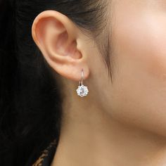 When this leverback earring is worn on the ear, the stone located directly under the earlobe sparkles brilliantly. The beauty of the stone is maximized by taking advantage of the leverback, which gives comfort as if not worn. Even without other details, the beauty of the stone itself shows the extreme splendor. As a replacement for real diamond earrings, it can be worn every day. Steadfastly beautiful, these earrings add the perfect dose of sparkle to your everyday style. Surprise her with Sterl Round Diamond Crystal Earrings For Anniversary, Diamond Crystal Earrings For Anniversary, Round Cut Diamond Crystal Earrings For Anniversary, Anniversary Diamond Crystal Earrings Round Cut, Anniversary Diamond Crystal Round Earrings, Anniversary Diamond Crystal Earrings, Anniversary Round Cut Diamond Crystal Earrings, Diamond White Crystal Round Earrings, Round Diamond White Crystal Earrings With Diamond Accents