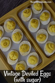 vintage deviled eggs with sugar in an egg tray