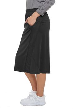 Travel Skirt 26 Black by Snoga Athletics Sporty Flowy Skirt With Built-in Shorts, Versatile Skirt With Stretch And Pockets, Stretch Skort With Side Pockets For Sports, Stretch Skirt With Pockets For Sports, Sports Skirt With Stretch And Pockets, Stretch Sports Skirt With Pockets, Casual Relaxed Tennis Skirt, Casual Knee-length Skort With Built-in Shorts, Sporty Skirt With 4-way Stretch And Elastic Waistband