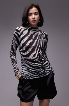 A bold zebra print ensures a head-turning look in this funnel-neck top made from crinkled woven fabric. 24 1/2" length (size Medium) Funnel neck Long sleeves 100% polyester Machine wash, line dry Imported Spring Zebra Print Tops, Spring Zebra Print Stretch Top, Spring Stretch Zebra Print Top, Black Zebra Print Party Top, Black Zebra Print Top For Workwear, High Neck Long Sleeve Top, High Neck Top, High Neck Long Sleeve, Brunch Outfit