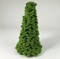 a crocheted green christmas tree on a white background