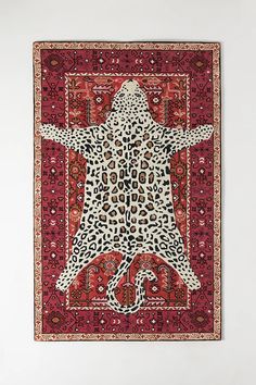 an animal print rug hanging on the wall