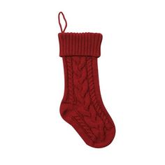 a red knitted stocking hanging on a white wall