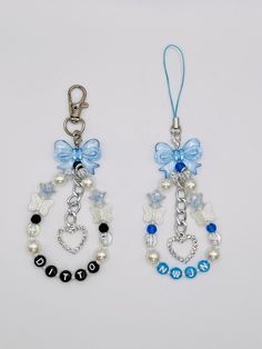 two pairs of blue and white beaded earrings with bows on the ends, hanging from chain