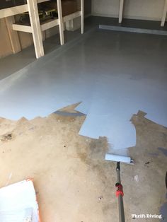 the floor is being painted and ready to be put into place in the garage area