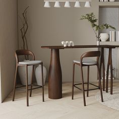 a dining room table with chairs and a vase