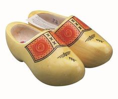 wooden slippers with native designs on them