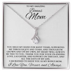 a necklace with the words to my amazing mom on it and an image of a diamond pendant