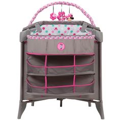 a baby crib with minnie mouse decorations on the top and pink trimmings