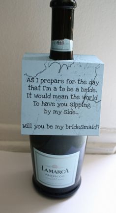 a wine bottle with a note attached to it