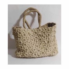 Handmade, tote bag, made with with two coloured natural jute and burlap inside.It is hand crocheted,in a puff flower pattern, it has a magnetic clasp closure and an inner pocket, with zipper. A unique beach bag,quite big,that you can use as a shopping bag as well, through spring and summer. A very stylish and eco-friendly gift for youself or someone you love, a bag that you will have for many,many years. Weight:1350 gr Dimentions: 40*30*12cm Eco-friendly Beige Shoulder Beach Bag, Eco-friendly Beige Rectangular Beach Bag, Handmade Beige Summer Shoulder Bag, Handmade Beige Canvas Shoulder Bag, Handmade Beige Shoulder Bag For Summer, Beige Canvas Beach Bag With Handles, Eco-friendly Woven Cream Beach Bag, Neutral Crochet Shoulder Bag For Beach, Eco-friendly Cream Woven Beach Bag