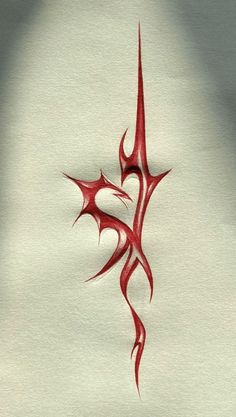 an artistic red tattoo design on white paper