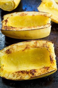 two halves of squash on a baking sheet ready to be cooked in the oven for roasting