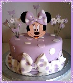 a minnie mouse cake with polka dots and bows