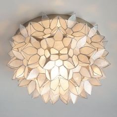 a white light fixture hanging from the ceiling