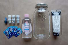 the contents of a mason jar, toothpaste, and other items are laid out