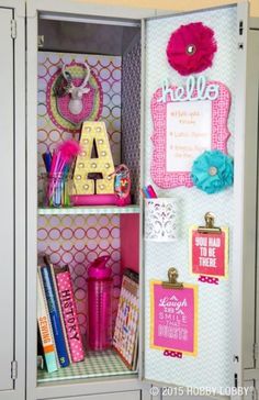 an open locker with school supplies and decorations on the inside, including magnets, pens, paper clips, and other items