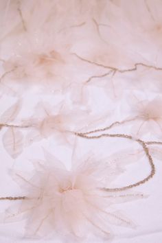 a white table cloth with flowers on it