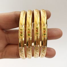 ❤️DISCOUNT AND OFFERS❤️ Please contact us for any discounts or offers that are available on this item. We also provide discounts on bank transfers. Please check the payments methods below! ❤️WEIGHT AND SPECIFICATIONS❤️ *14Kt Solid Gold weight (4 Pieces) :- 10.5 Grams Approx (Without metal bangles) *18Kt Solid Gold weight (4 Pieces) :- 13.170 Grams Approx (Without metal bangles) *22Kt Solid Gold weight (4 Pieces) :- 16 Grams Approx (Without metal bangles) * As these gold bangles are very light in Gold Hand Set Bracelet, Gold 14k Bangle, Hallmarked Gold Bangle In 14k Gold, Hallmarked 14k Gold Bangle, Traditional 14k Yellow Gold Bangle, Adjustable Gold Hallmarked Bangle, Gold Bracelets, Gift 22k Gold Yellow Bangle, Hand-set 14k Gold Bangle