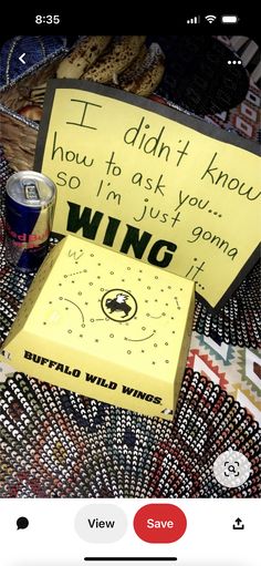 a yellow post it note sitting on top of a table next to a can of soda