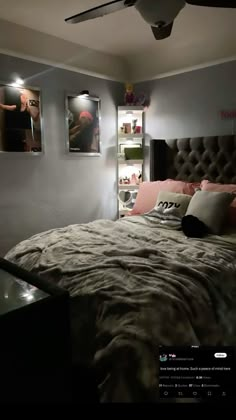 a bedroom with a bed and pictures on the wall