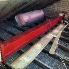 a red conveyor belt in an attic