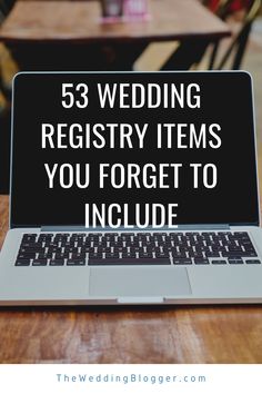 a laptop computer sitting on top of a wooden table with the words, 53 wedding registry items you forget to include