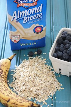 blueberries, oatmeal, and milk on a table