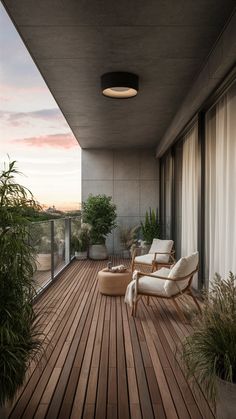 a balcony with chairs and plants on it