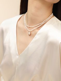 Introducing the "COCOKIM Embellished Series Double-Layer Pearl Necklace," a must-have accessory for pearl lovers. This necklace embodies princess elegance with its graceful double-layer design and sweet sophistication.Whether you're dressing up for a special occasion or adding a touch of elegance to your everyday look！ Metal: 14K Gold Filled Gemstone: Freshwater Pearl Small Pearl Dimensions: 60*40mm Large Pendant Pearls Dimensions: 180*150mm (including metal parts) Inner Chain Length: 380mm Oute Elegant Double Strand Necklace With Pearl Charm, Elegant Double Strand Pearl Necklace With Clavicle Chain, Elegant Double Strand Clavicle Pearl Necklace, Elegant Double Strand Pearl Necklace With Pendant, Elegant Double Strand Pearl Drop Jewelry, Elegant Double Strand Pearl Embellished Necklace, Elegant Double Strand Pearl Necklace With Charm, Elegant Double Strand Pearl White Pearl Necklace, Elegant Double Strand Pearl Necklace