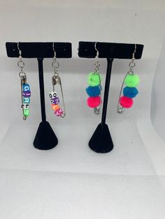 Customizable safety clips. Can be made to say any four to five  letter words. Five Letter Words, Safety Pin Earrings As Gift, Trendy Safety Pin Earrings For Pierced Ears, Safety Pin Earrings Grunge, Everyday Safety Pin Single Earring, Silver Safety Pin Shaped Earrings For Gift, Large Safety Pin, Pin Earrings, Safety Pin Earrings