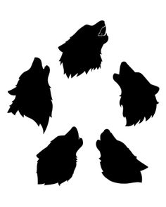 the silhouettes of four wolf heads against a white background