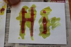 the child's handprint has been placed on paper with red and yellow ink