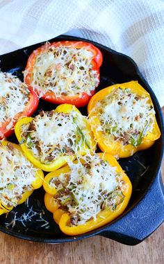 stuffed peppers with cheese and herbs in a skillet