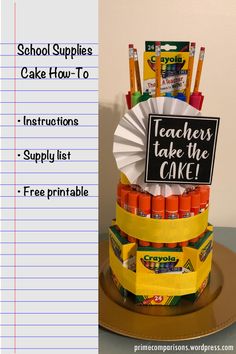 there is a cake made out of school supplies on top of a table with the words teachers take the cake