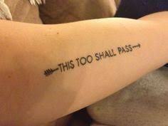 this too shall pass tattoo on the back of a woman's left arm with an arrow