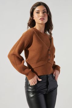 Day date, grocery shopping, farmer's market, this cardi is all you're going to want to live in. It highlights an easy-to-wear fit with long balloon sleeves. It has a simple button front feature that leads to a cropped sweep. Wear it over the matching tank or your favorite midi dress for warmth.- Ribbed knit- Button front- Cropped- Classic fit- Color: ChocolateSize + Fit - Model is 5'8" and wearing size XS- Measurements taken from size S - Chest: 35"- Length: 16 3/4" Fabric Self: 56% Viscose, 27% Brown Ribbed Cardigan For Work, Brown Fall Cardigan, Brown Sweater For Layering With Button Closure, Brown Button-up Sweater For Layering, Brown Button-up Cardigan For Fall, Long Balloons, Farmer's Market, Grocery Shopping, Balloon Sleeves