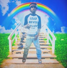 a man standing on a wooden bridge with a rainbow in the sky behind him that reads lead never follow