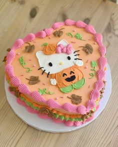 a hello kitty birthday cake on a plate